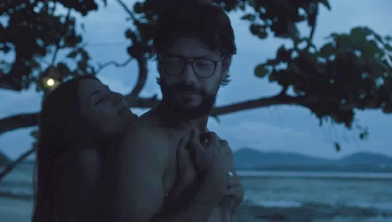 Intriguing woman in a dimly lit room