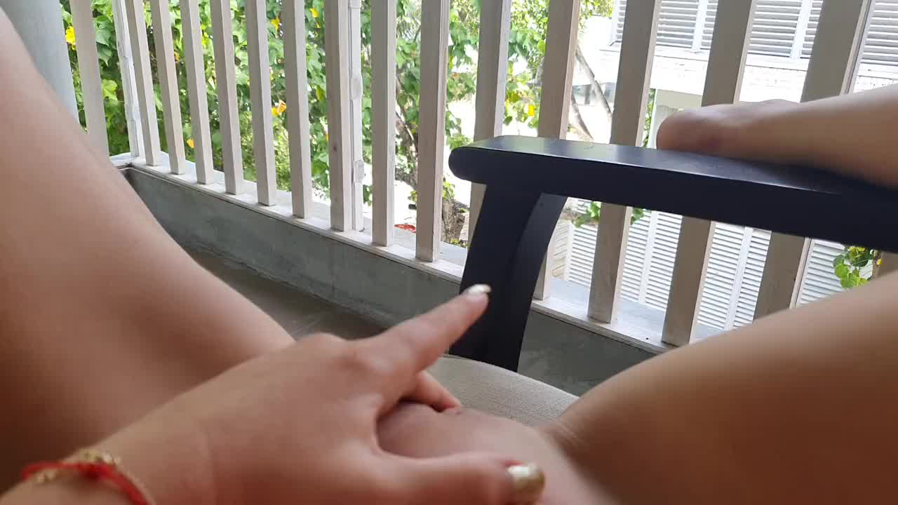 A woman touching her pussy in front of people