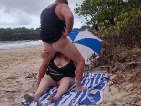 Inhaling In Front Of Surfers At The Beach