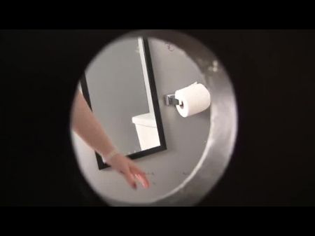 Riley Evans Deepthroats A Dick In The Gloryhole Bathroom