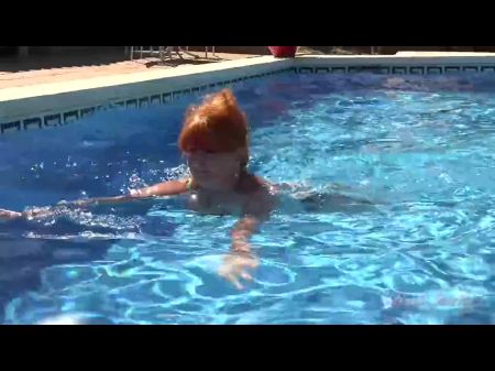 Huge-boobed Worn Redhead Melanie Heads For A Swim In The Pool