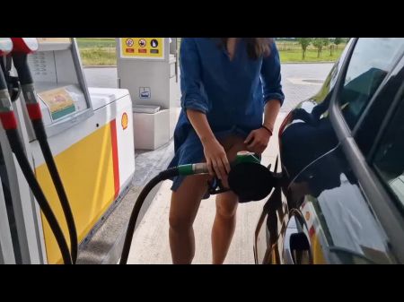 She Is Refueling At The Gas Station , Demonstrating Her Breast And Puss