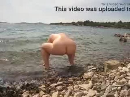 Wife Urinating On The Beach