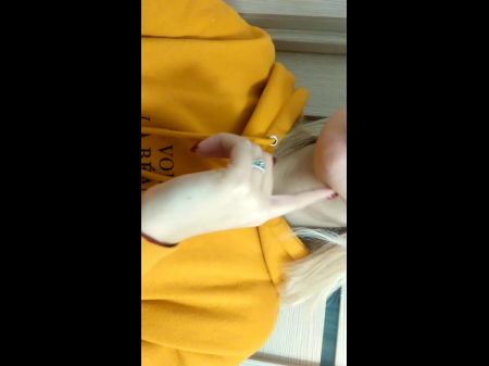 Home Daytime Strip In A Yellow Hoodie . Close - Up