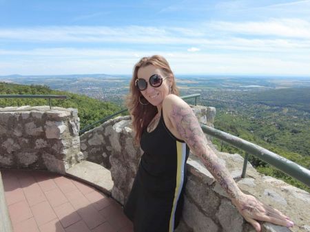 Tattooed Mum Is Hiking In The Woods . She Enjoys Summer And Outdoor Bareness